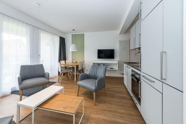 Deichhäuser Anna Küste - Apartment nah der See mit großer Terrasse, Parkplatz, Schwimmbad- & Saunanutzung