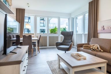Aparthotel Ostseeallee - Modernes Apartment in Strandnähe für 6 Personen mit Terrasse und zwei Bädern
