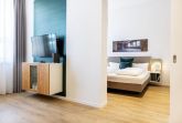 Wohn-/Essbereich mit Zugang zum Schlafzimmer