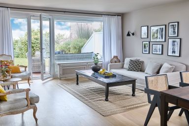 TECHTs  Apartmenthaus - Apartment „Seestern“ – Stilvoller Rückzugsort mit Terrasse und wunderschönem Garten