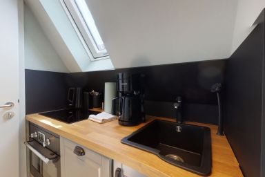 Sylter Glanz - Modernes 1-Raum Appartement mit durchdachtem Konzept und Sauna in strandnaher Lage.