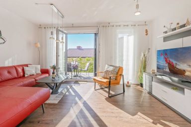 Ferienhaus Nordwind mit 2 Schlafzimmern, Terrasse und Strandkorb - Modernes Ferienhaus mit Garten – strandnah & familienfreundlich