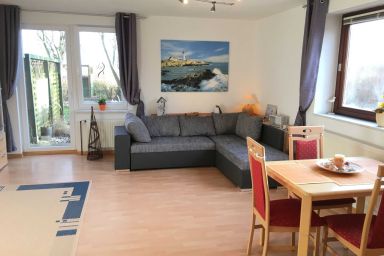 Haus Strandmuschel - Ferienwohnung Gartenblick