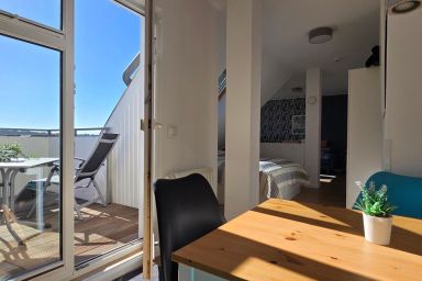 Ferienwohnung S40 "Sonnendeck" - Moderne Fewo für zwei Personen in unmittelbarer Strandnähe mit WLAN.