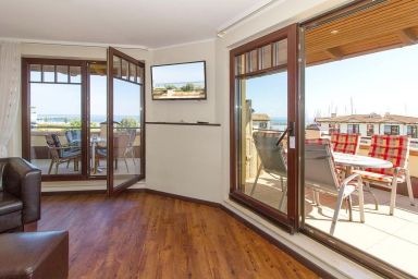 Urlaubsräume am Meer - Exklusives Penthouse am Yachthafen mit großer Dachterrasse, Meerblick und Sauna!