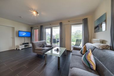 NordseeResort Friesland - Tolles Ferienapartment an der Nordsee mit Südbalkon, Sauna und Whirlbadewanne