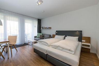 Deichhäuser Anna Küste - Strandnahes 1-Zimmer Apartment mit Balkon, Parkplatz, Schwimmbad- & Saunanutzung