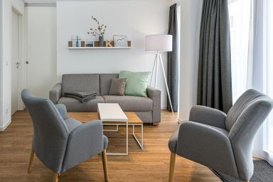 Deichhäuser Anna Küste - Tolles Ferienapartment mit großem Balkon, Parkplatz, Schwimmbad- & Saunanutzung