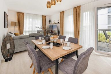 Ferienwohnung Hart Backbord - Modernes Appartement mit Balkon – strandnah und familienfreundlich