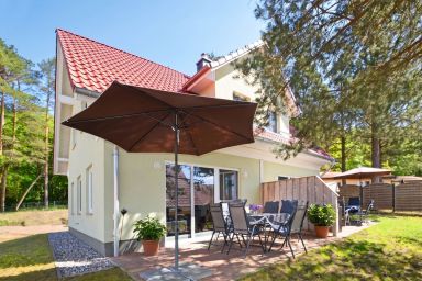 Ferienhaus Waldhaus 6 mit Kamin, Sauna und Terrasse - Gemütliches Ferienhaus in Korswandt mit Garten, nahe See & Strand