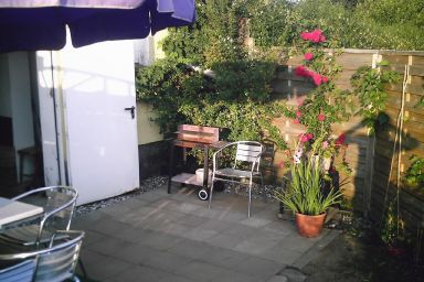 Ferienwohnung mit Sitzecke im Grünen.