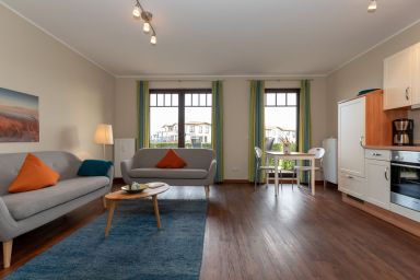 Urlaubsräume am Meer - Haustierfreie Ferienwohnung am Yachthafen mit Terrasse und Sauna in der Anlage