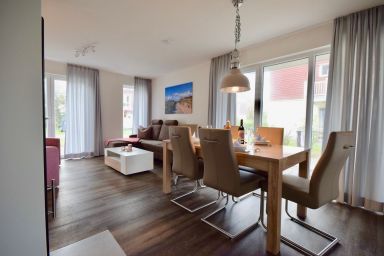 NordseeResort Friesland Ferienhäuser - Nordsee-Ferienhaus mit Privatsauna, Kamin, Südterrasse & Balkon mit Meerblick