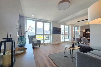 Ferienappartment Hafenblick mit Sauna - Modernes Ferienappartment mit privater Sauna, Balkon und Hafenblick in Norden
