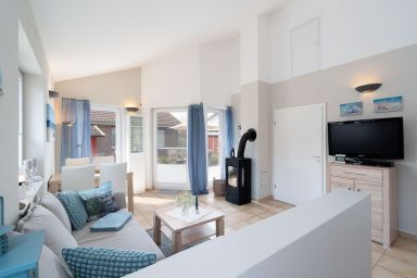 Feriendorf Südstrand - Strandnahes Ferienhaus für 4 Personen mit Kamin, Garten, Strandkorb & Hund