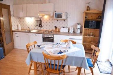 Ferienhaus Fünf Trabanten - Ferienwohnung Deichblick 1
