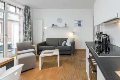 Ferienvillen Anna Düne - Schöne Familien-Ferienwohnung mit sonnigem Süd-Balkon - 100 m zum Nordseestrand!