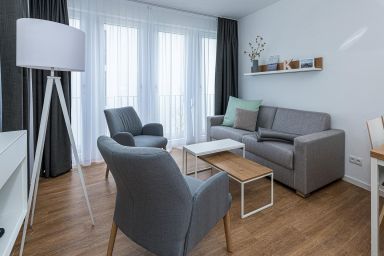 Deichhäuser Anna Küste - Strandnahes Ferienapartment mit Balkon, Parkplatz, Schwimmbad- & Saunanutzung