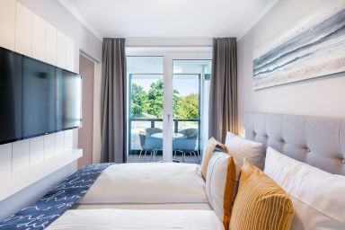 Godewindpark Travemünde - Modernes Apartment am Godewindpark mit überdachtem Balkon und Wellness