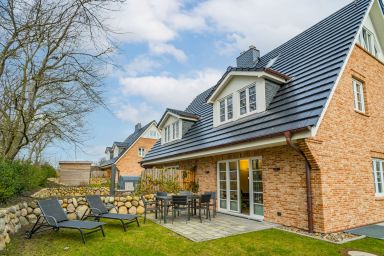 Sylt Oase - Doppel-Ferienhaushälfte für max. 6 Personen mit Sauna, Garten und Kinoraum