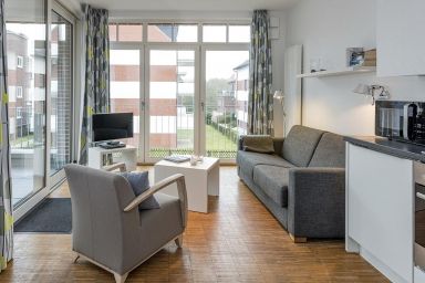 Ferienvillen Anna Düne - Barrierearme Ferienwohnung mit geschützter, sonniger Loggia - 100 m zum Strand!