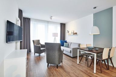 Deichhäuser Anna Küste - Strandnahes, modernes Apartment mit Terrasse inkl. Schwimmbad- & Saunanutzung