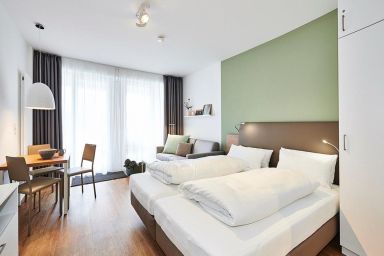 Deichhäuser Anna Küste - Strandnahes Ferienapartment mit Terrasse inkl. freier Schwimmbad- & Saunanutzung