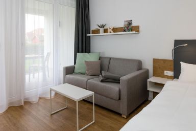 Deichhäuser Anna Küste - Strandnahes Apartment mit Terrasse inkl. Parkplatz, Schwimmbad- & Saunanutzung