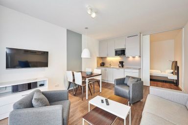 Deichhäuser Anna Küste - Ferienapartment nahe der See mit zwei Terrassen inkl. Schwimmbad- & Saunanutzung