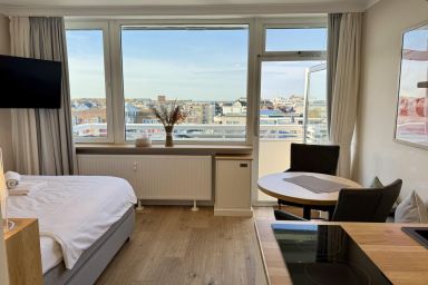 Seeluft - Modernes 1-Zimmer-App. mit Balkon und Meerblick, PKW-Stellplatz, WLAN.