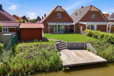 Friesenperle - Tolles Ferienhaus (85qm) für 4 Personen mit Kamin direkt am Wasser