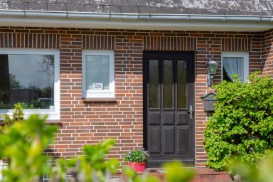 NEU 2024 - Ferienwohnung Charlie - Idyllische Erdgeschosswohnung mit Garten in zentraler Lage von Wenningstedt