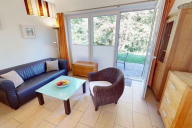 Feriendorf Südstrand - Strandnahes Ferienhaus für 4 Personen mit eingezäuntem Garten und Kamin