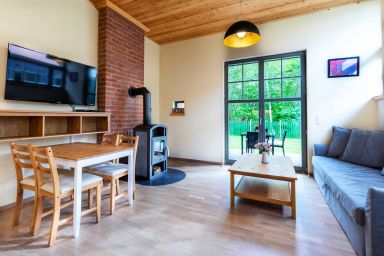 Ferienhaus Sonne, Mond und Sterne bei Kühlungsborn OFC 14 - Ferienwohnung Sonne mit Terrasse, Kamin und Garten