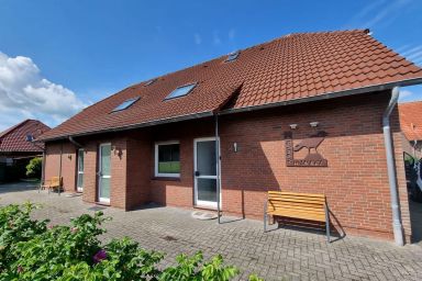 Ferienwohnung Ostwind Neßmersiel - Komfortable Ferienwohnung Ostwind in Neßmersiel mit Terrasse und Garten