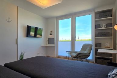 Ferienwohnung i10 - Komfortable Ferienwohnung i10 mit überdachter Terrasse in erster Strandreihe