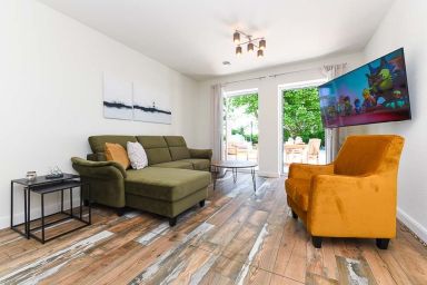 Hof zwischen den Deichen im Wangerland - Ferienwohnung Treckerschuppen