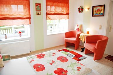 Appartementhaus zur Brücke direkt am See - Ferienappartement Mohnblume mit Seeblick und Terrasse