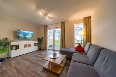 NordseeResort Friesland - Schönes Ferienhaus mit Sauna, Kamin, großer Süd-Terrasse und Balkon zum Meer