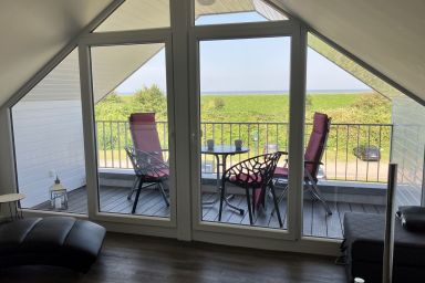 NordseeResort Friesland Ferienhäuser - Ferienhaus a. d. Nordsee mit Privatsauna, Kamin, Südterrasse und Meerblickbalkon