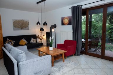 Ferienwohnung Maximus - mit Terrasse und Garten - Ferienwohnung Maximus - Gartenidylle & Morgensonne auf Rügen