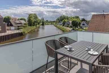 Ferienwohnung Harleblick 50016 - Maritimes Flair, exklusives Ambiente und unvergessliche Ausblicke – ein Feriendomizil für Gäste, die das Besondere suchen.