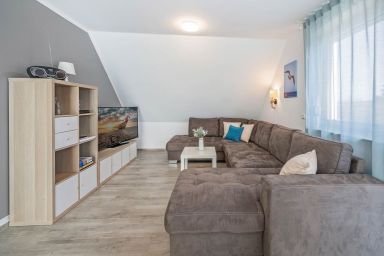 Ferienhaus Strandmöwe OG mit Balkon sowie Garten mit Spielanlage - Moderne Ferienwohnung in Loddin mit Garten, WLAN & Grill – ruhig, strandnah, modern