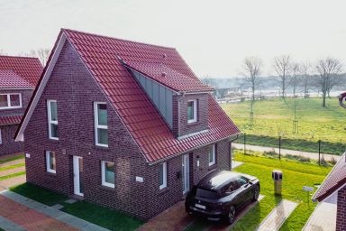 Küsten Apartments Tannenhausen - Ferienhaushälfte Wasserseite