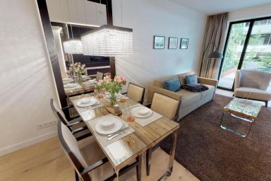 White Pearl - Luxusapartment 0.11 mit Sauna, Strandkorb, Liegen und großer Terrasse.