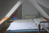 Doppelbett im Spitzboden
