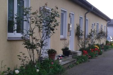 Ferienwohnung mit Sitzecke im Grünen.