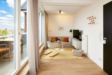 Lüttjeod Apartmentvilla - Traumferienwohnung für Paare mit toller Loggia auf der autofreien Insel Langeoog