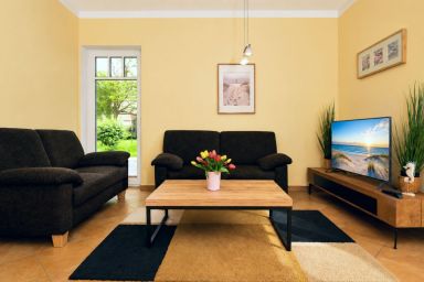 Wohnung Strandkrabbe 02 - Gemütliche 60m² Ferienwohnung mit Terrasse, Kamin & 2 Schlafzimmern
