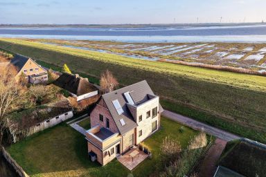 Deichkoje 12 Deck 1 - Ferienwohnung mit Deichblick und eingezäuntem Garten, nur 7 km zur Nordsee